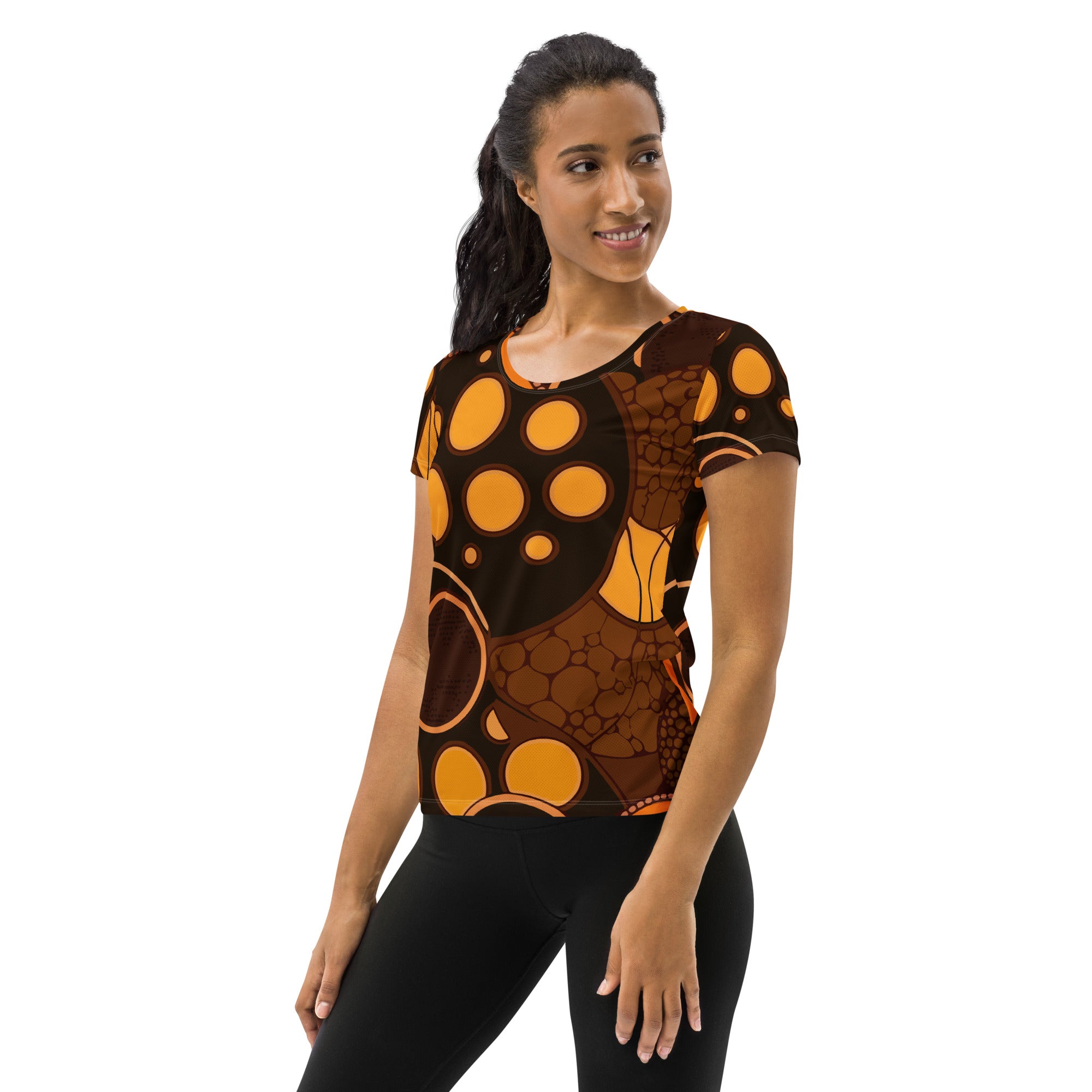 Women's Stretch Fit Athletic Sports T-shirt in orange and brown spotted print, showcasing its flexible fit and stylish design.