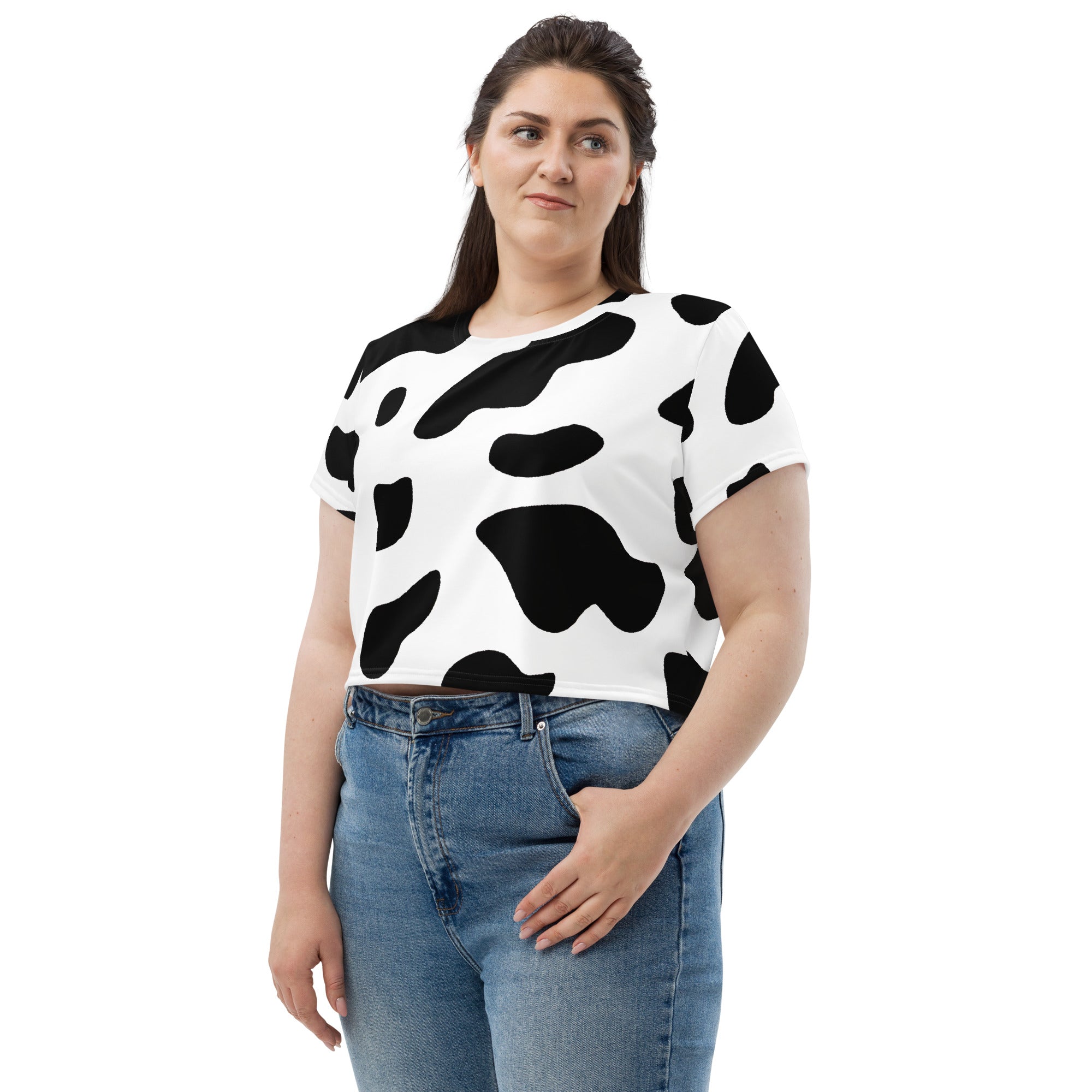 Women's Stretch Fit Crop Tee in Black White Cow Print, showcasing a stylish cropped design with short sleeves and a crew neckline.