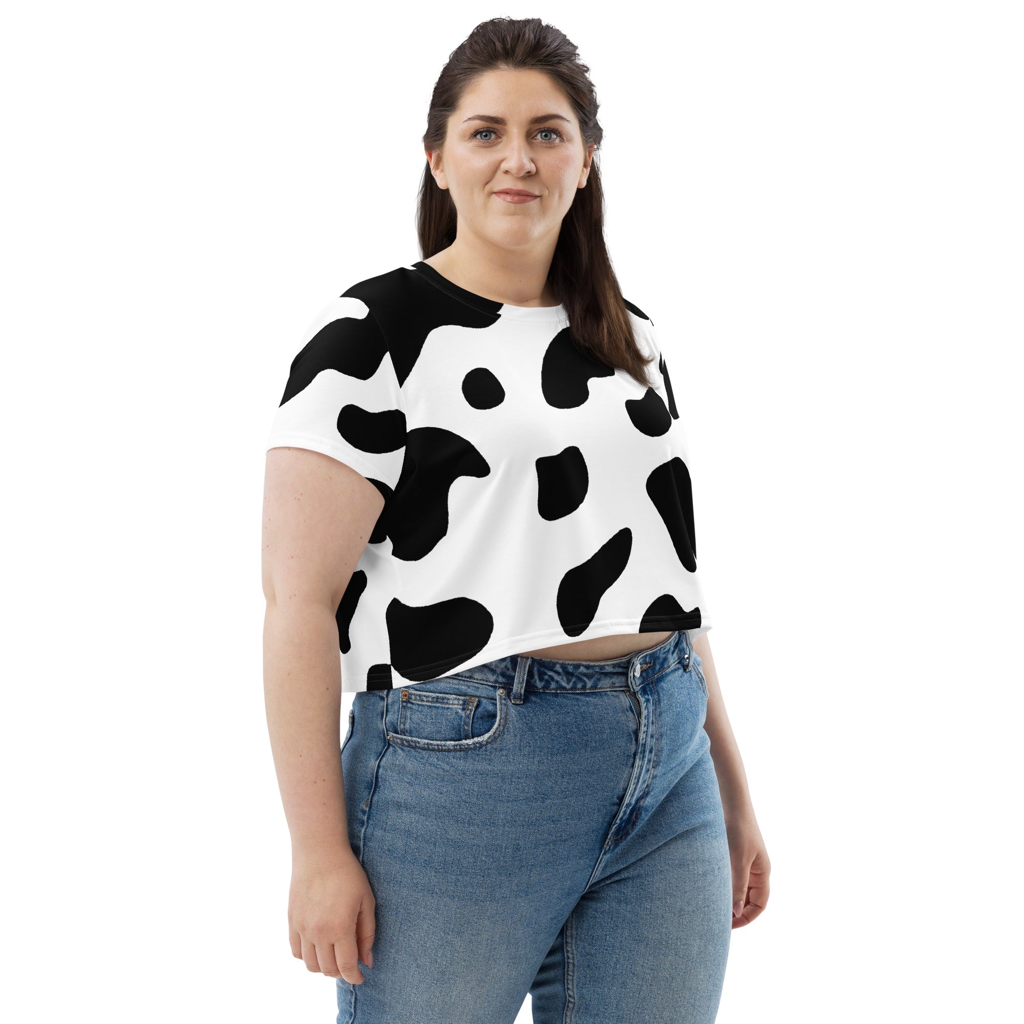 Women's Stretch Fit Crop Tee in Black White Cow Print, showcasing a stylish cropped design with short sleeves and a crew neckline.