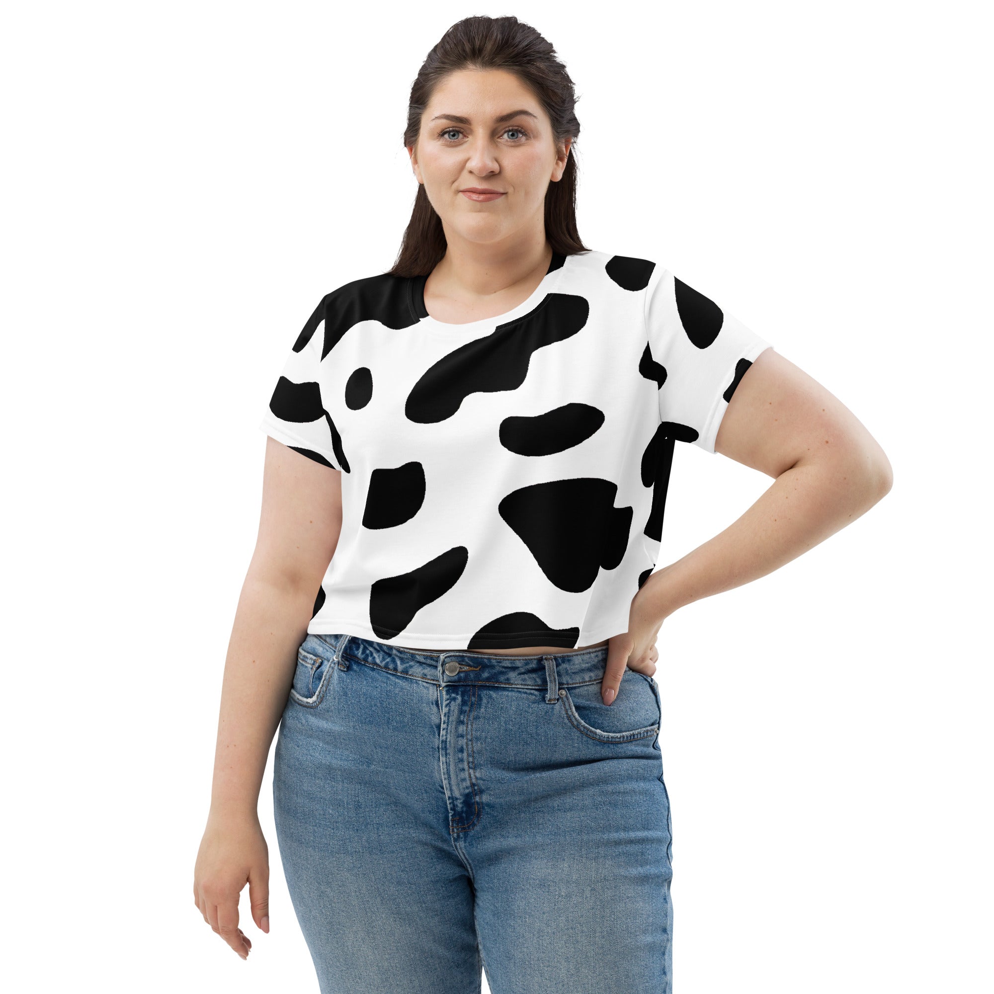Women's Stretch Fit Crop Tee in Black White Cow Print, showcasing a stylish cropped design with short sleeves and a crew neckline.