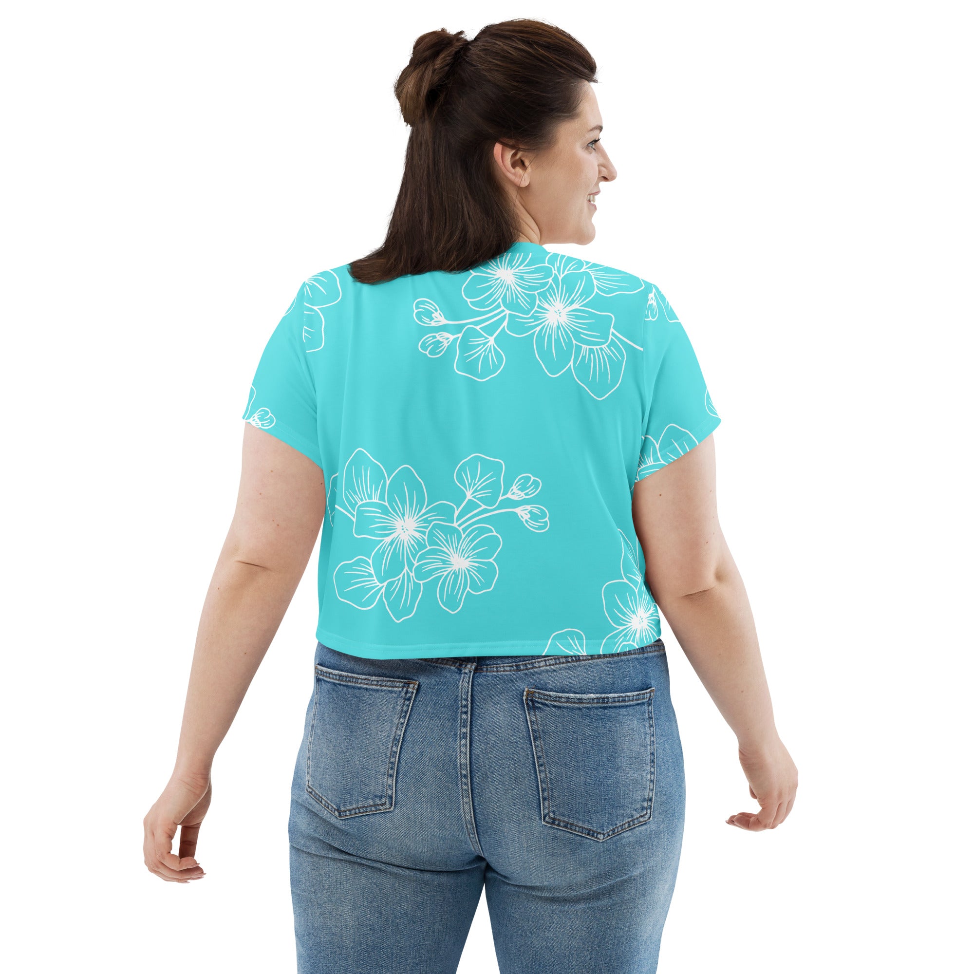 Women's Stretch Fit Crop Tee in Floral Cyan Blue, showcasing a stylish design with a cropped silhouette and short sleeves.