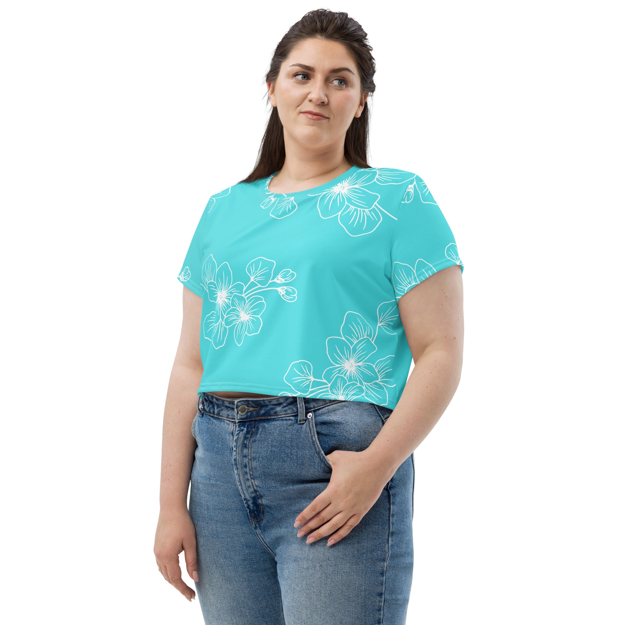 Women's Stretch Fit Crop Tee in Floral Cyan Blue, showcasing a stylish design with a cropped silhouette and short sleeves.
