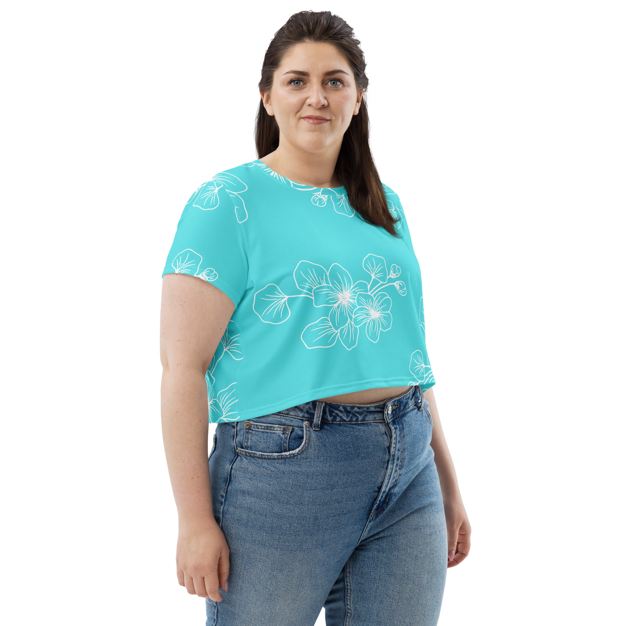 Women's Stretch Fit Crop Tee in Floral Cyan Blue, showcasing a stylish design with a cropped silhouette and short sleeves.