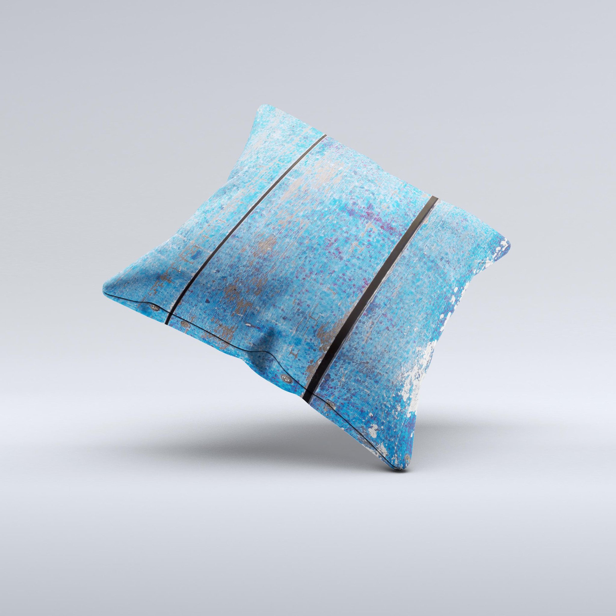 Handcrafted decorative throw pillow featuring a worn blue paint design on wooden planks, showcasing unique imperfections and high-quality fabric.