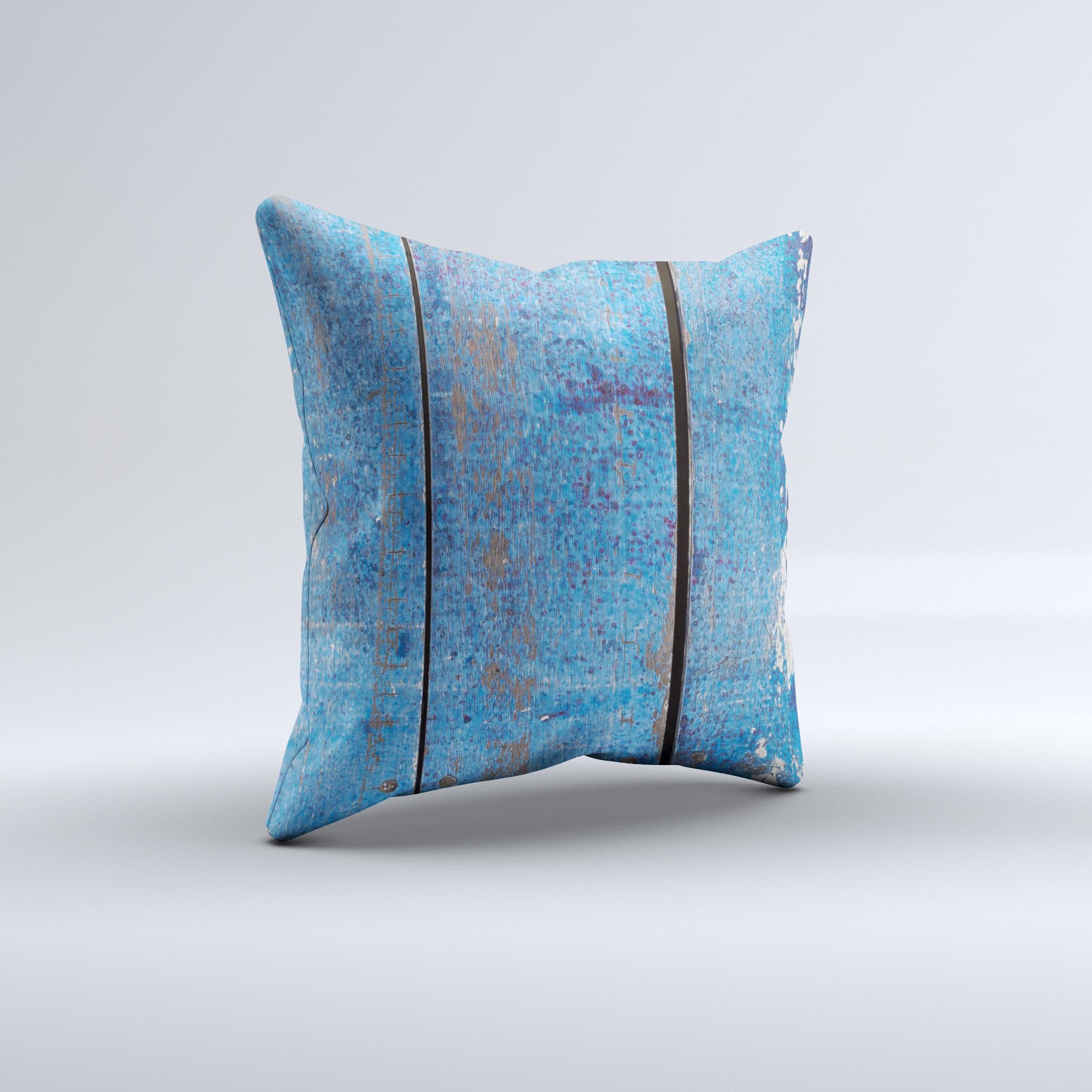 Handcrafted decorative throw pillow featuring a worn blue paint design on wooden planks, showcasing unique imperfections and high-quality fabric.