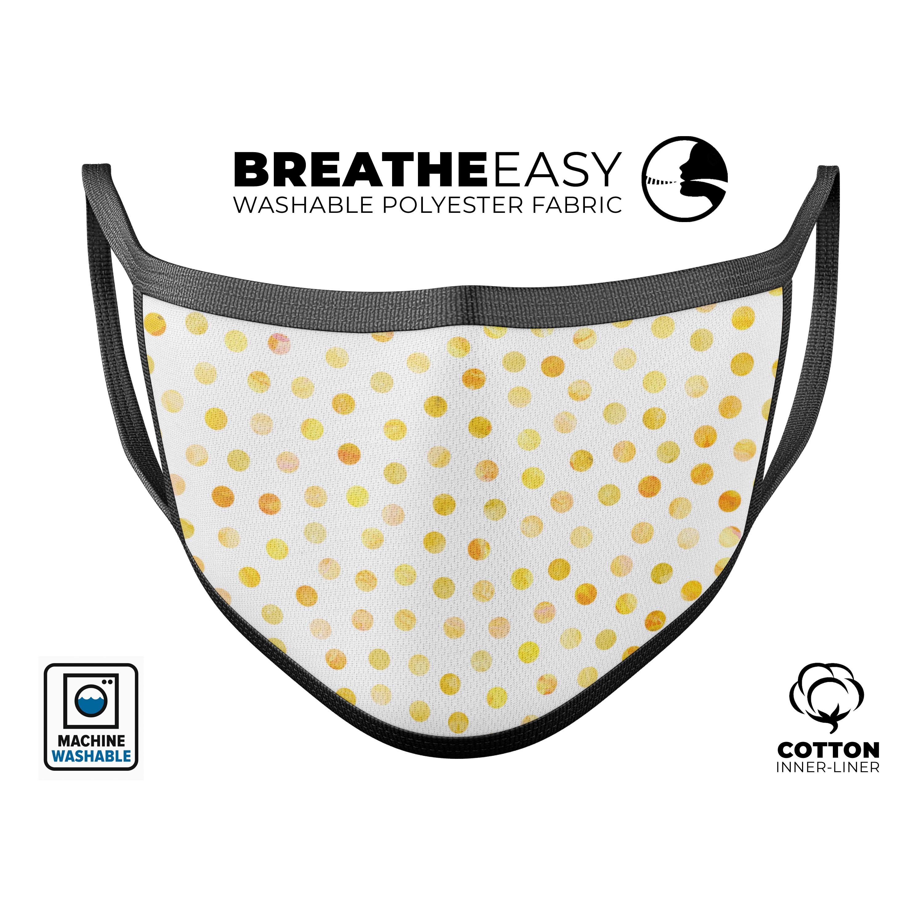 Yellow watercolor dots pattern on a white reusable face mask, showcasing adjustable ear loops and soft cotton interior.