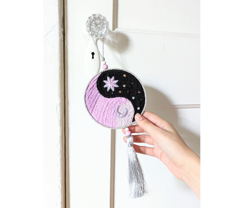 Yin Yang Decorative Hanger featuring a circular design with a tassel, symbolizing balance and harmony, perfect for home decor.
