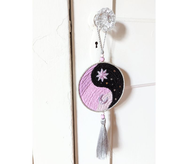 Yin Yang Decorative Hanger featuring a circular design with a tassel, symbolizing balance and harmony, perfect for home decor.