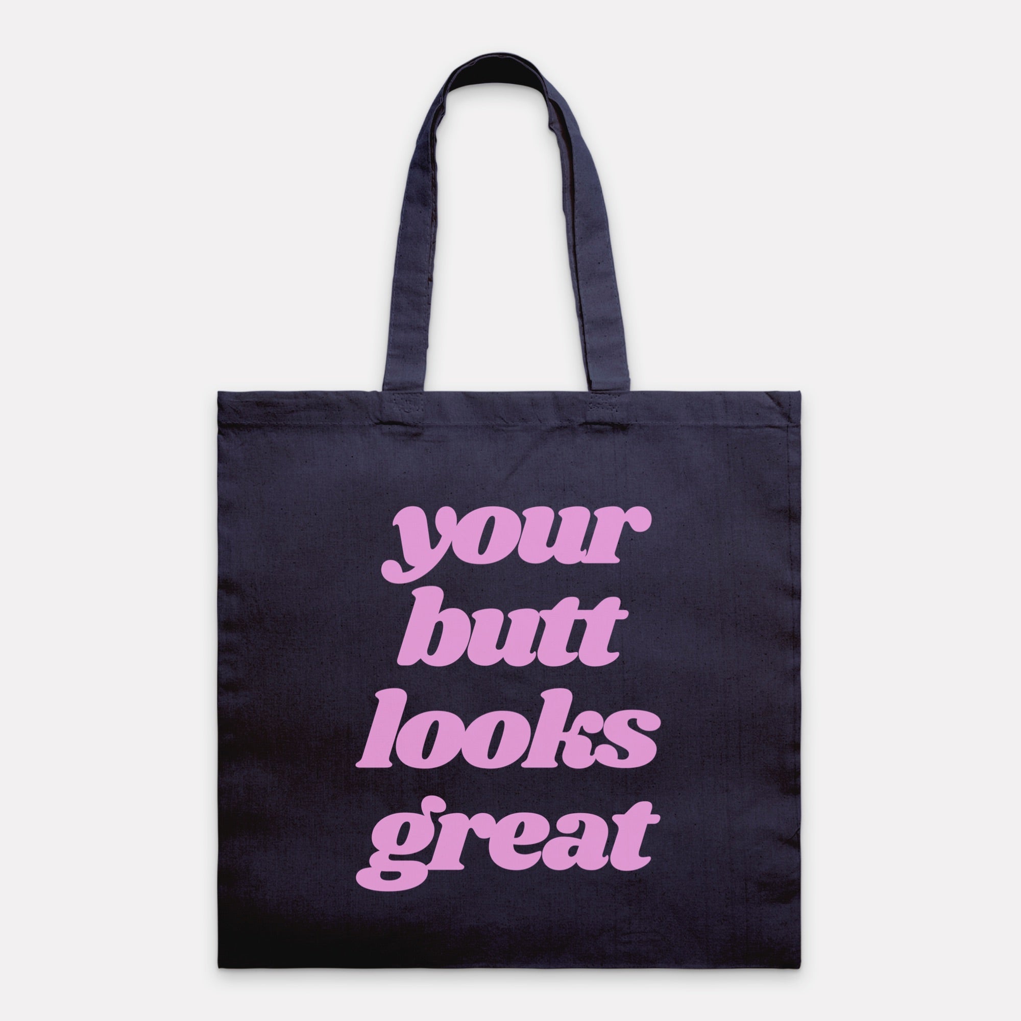 A stylish Your Butt Looks Great Tote Bag made of 100% cotton canvas, featuring a vibrant design and comfortable handles, perfect for shopping and travel.