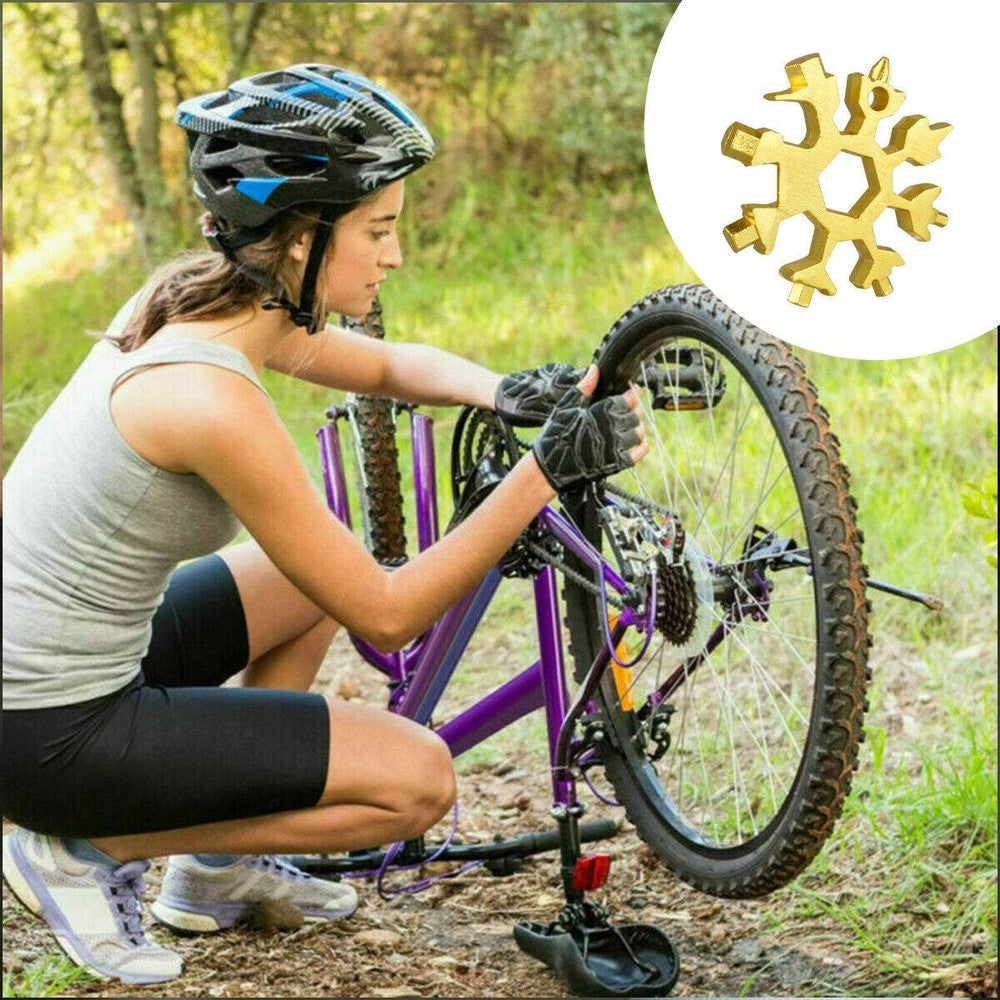 Three stainless steel snowflake-shaped multi-tools with various screwdrivers and hex wrenches, displayed with key rings.