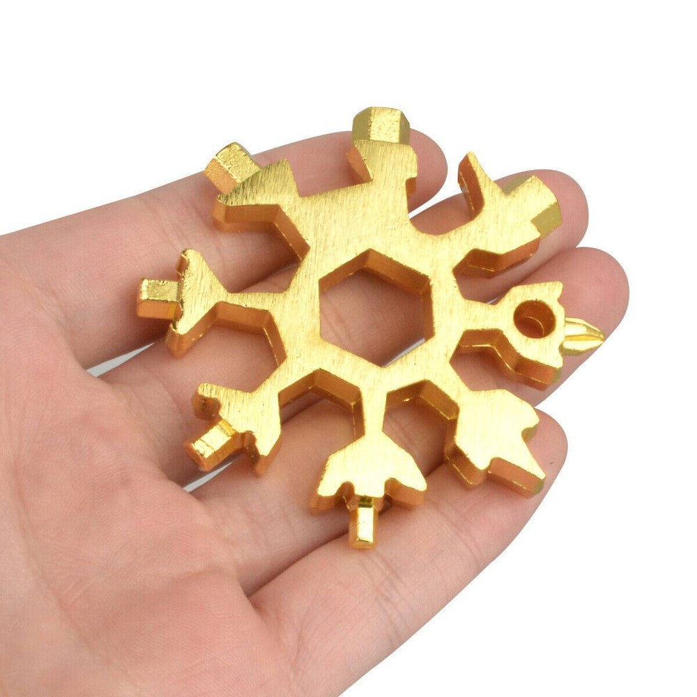 Three stainless steel snowflake-shaped multi-tools with various screwdrivers and hex wrenches, displayed with key rings.