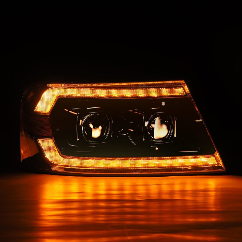 AlphaRex Chrome LUXX Series Projector headlights for 2004-2008 Ford F150, showcasing a sleek design and bright illumination.