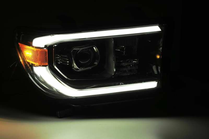 AlphaRex PRO-Series Projector Headlights for 2007-2013 Toyota Tundra, featuring sleek plank style design and advanced projector lens technology.