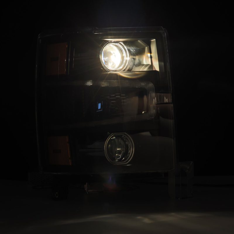 AlphaRex PRO-Series projector headlights for 2014-2015 Chevy Silverado 1500 in black with sequential lighting.