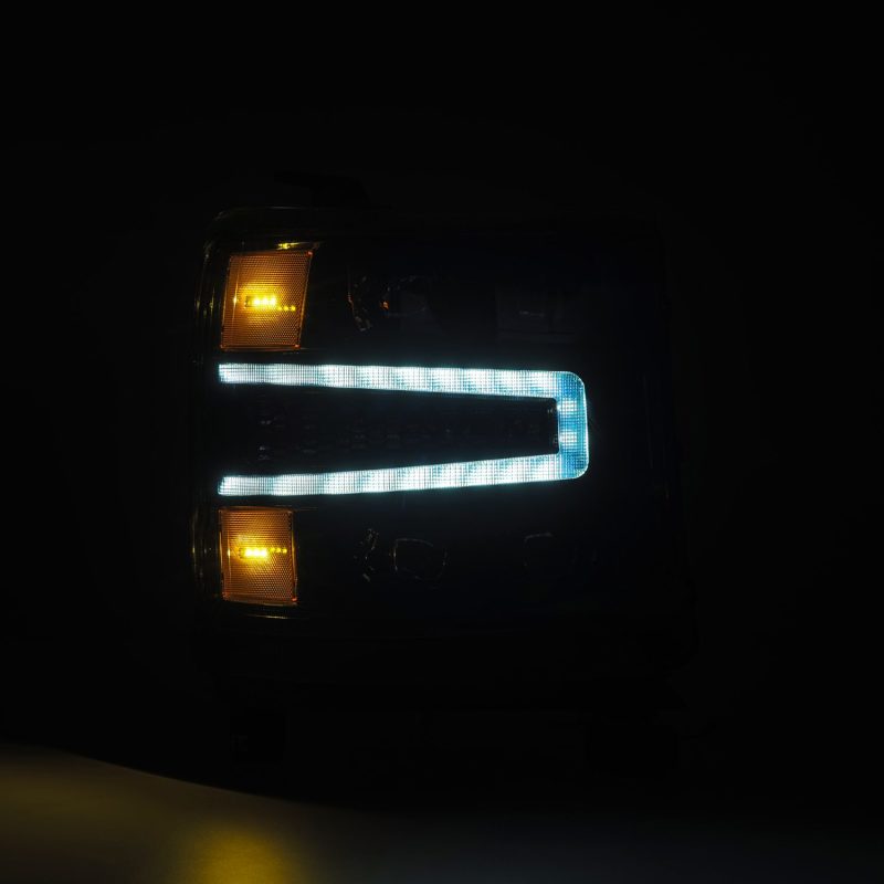 AlphaRex NOVA-Series LED projector headlights for 2016-2018 Chevy Silverado 1500, featuring sleek black design and advanced lighting technology.