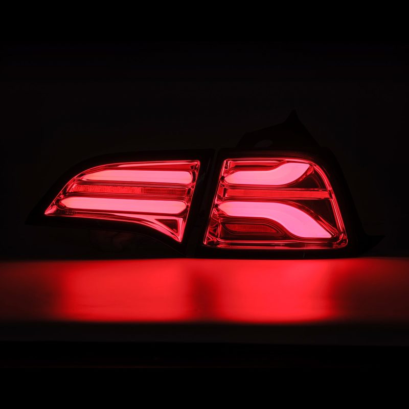 AlphaRex PRO-Series LED Tail Lights for Tesla Model 3 in Red Smoke finish, showcasing sleek design and bright LED illumination.