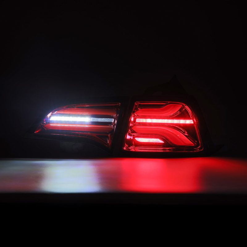 AlphaRex PRO-Series LED Tail Lights for Tesla Model 3 in Red Smoke finish, showcasing sleek design and bright LED illumination.