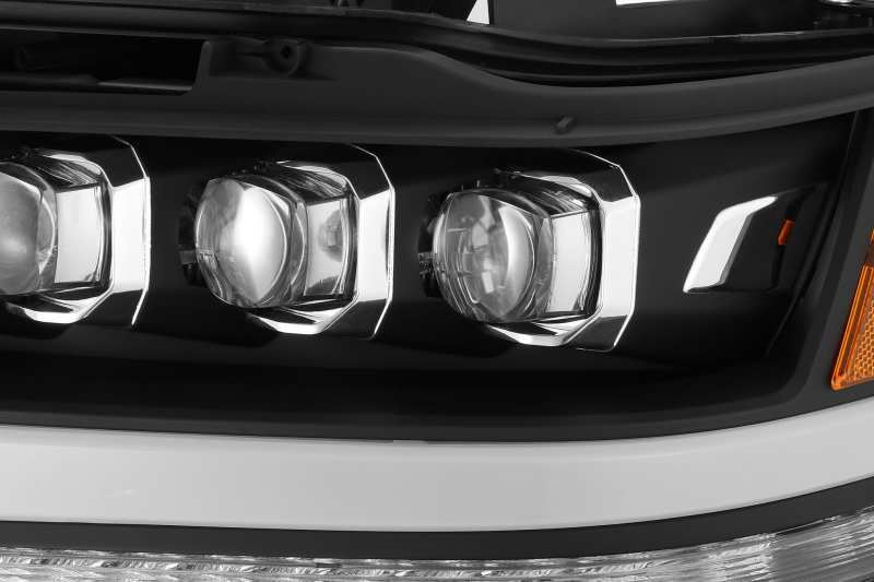 AlphaRex NOVA LED projector headlights for 2019-2020 Ram 1500, featuring a matte black finish and advanced lighting technology.