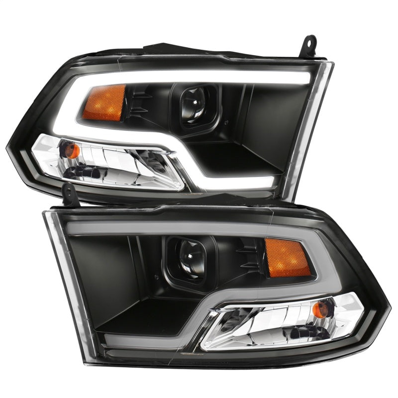ANZO 09-18 Dodge Ram 1500 Plank Style Projector Headlights in black finish, showcasing modern design and superior lighting technology.