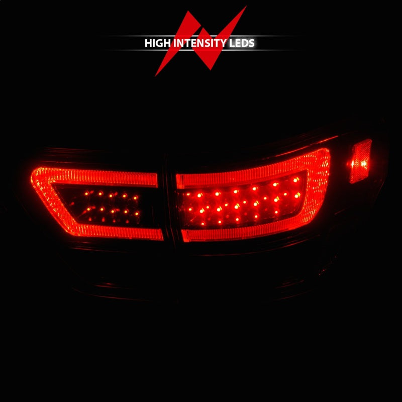 ANZO LED taillights for 2011-2013 Jeep Grand Cherokee with black housing and lightbar design.