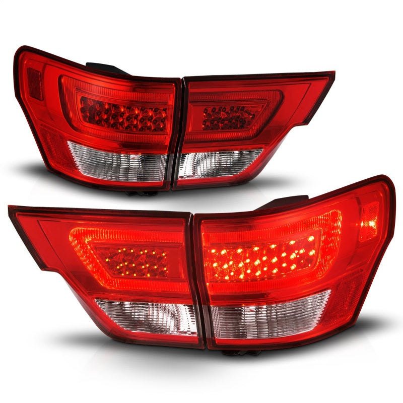 ANZO LED taillights for 2011-2013 Jeep Grand Cherokee with chrome housing and clear lens, showcasing modern design and enhanced visibility.