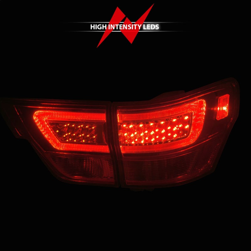 ANZO LED taillights for 2011-2013 Jeep Grand Cherokee with chrome housing and clear lens, showcasing modern design and enhanced visibility.