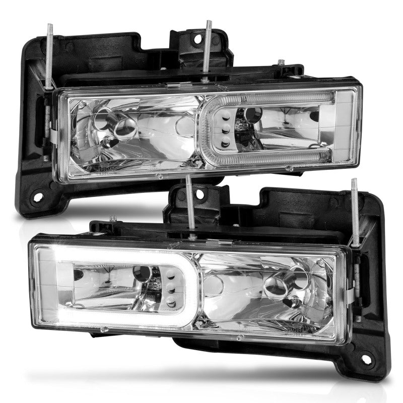ANZO 1999-2000 Cadillac Escalade Crystal Headlights with clear lens and black housing, showcasing modern design and enhanced visibility.