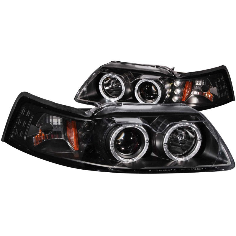 ANZO 1999-2004 Ford Mustang Projector Headlights with black housing and clear lens, showcasing dual projector design and halo feature.