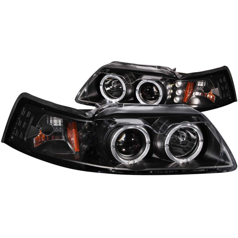 ANZO 1999-2004 Ford Mustang Projector Headlights with black housing and clear lens, showcasing dual projector design and halo feature.
