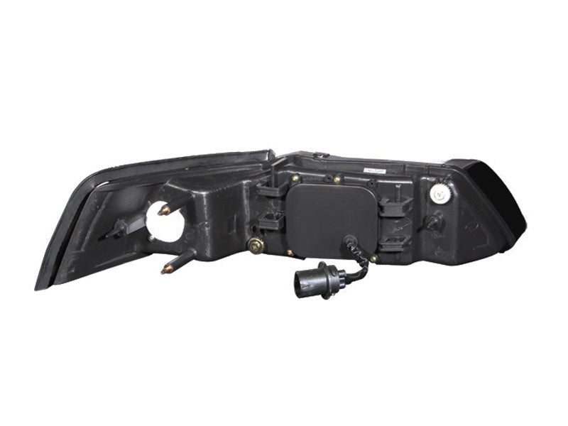 ANZO projector headlights for 1999-2004 Ford Mustang with clear lens and black housing, showcasing modern design and enhanced visibility.