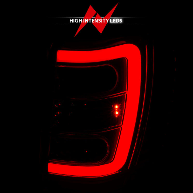 ANZO LED Tail Lights for 1999-2004 Jeep Grand Cherokee with chrome finish and light bar design.