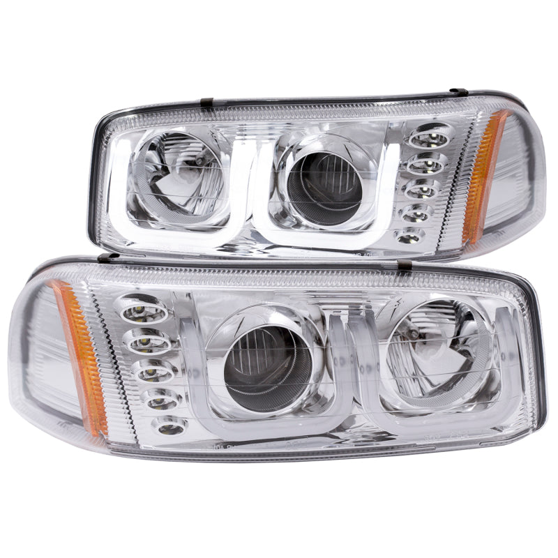 ANZO 1999-2006 GMC Sierra 1500 projector headlights with U-Bar chrome housing, showcasing clear lens and modern design.