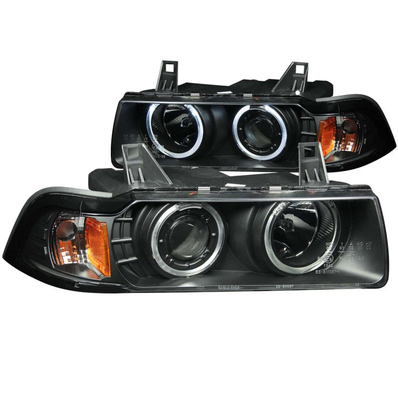 ANZO projector headlights with halo design for 1992-1998 BMW 3 Series E36, featuring clear lens and black housing.