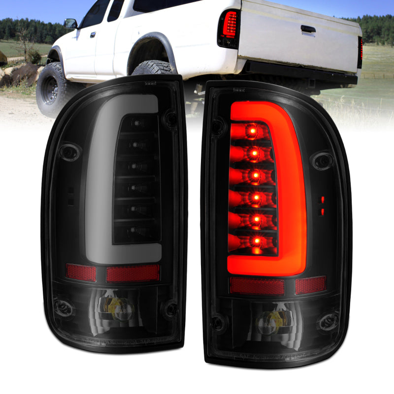 ANZO LED taillights for 1995-2000 Toyota Tacoma with black housing and smoke lens, showcasing modern design and enhanced visibility.
