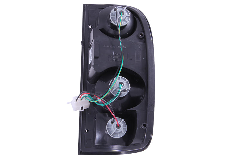 ANZO Black Taillights for 1995-2000 Toyota Tacoma, featuring clear lens and black housing for enhanced style and visibility.