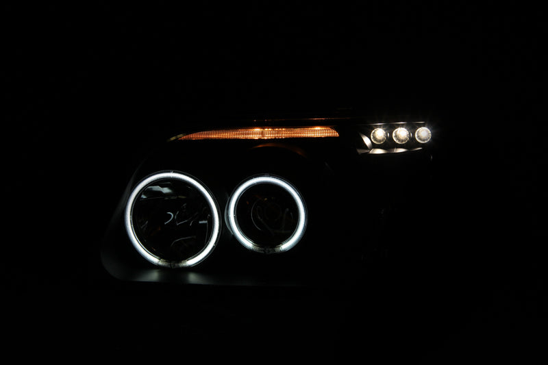 ANZO 1995-2001 Ford Explorer Projector Headlights with Halo in black housing, showcasing clear lens and modern design.