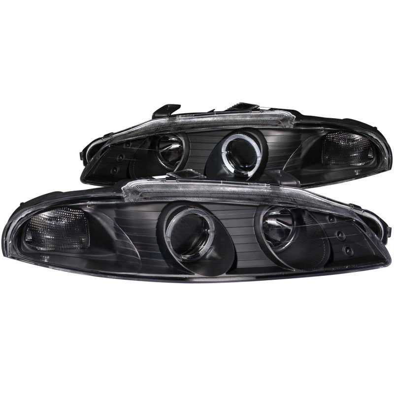 ANZO projector headlights for 1997-1999 Mitsubishi Eclipse with black housing and halo lights, showcasing modern design and clear lens.