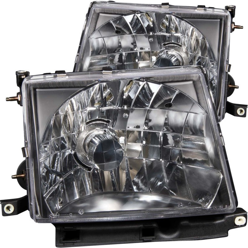 ANZO Crystal Headlights for 1997-2000 Toyota Tacoma with clear lens and black housing, enhancing vehicle appearance and visibility.