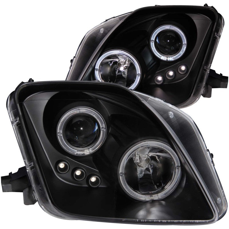 ANZO projector headlights for 1997-2001 Honda Prelude featuring black housing, halo rings, and LED lights.