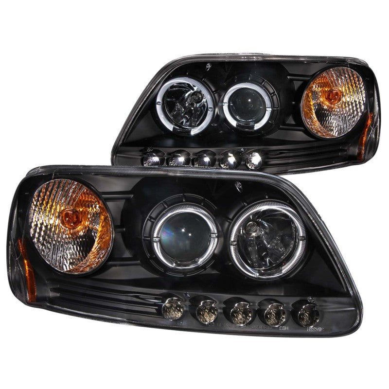 ANZO 1997.5-2003 Ford F-150 projector headlights with halo and LED lights in black housing, showcasing modern design and enhanced visibility.