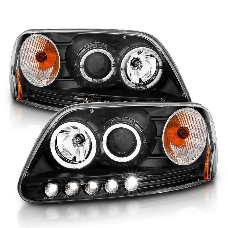 ANZO 1997.5-2003 Ford F-150 projector headlights with halo and LED lights in black housing, showcasing modern design and enhanced visibility.