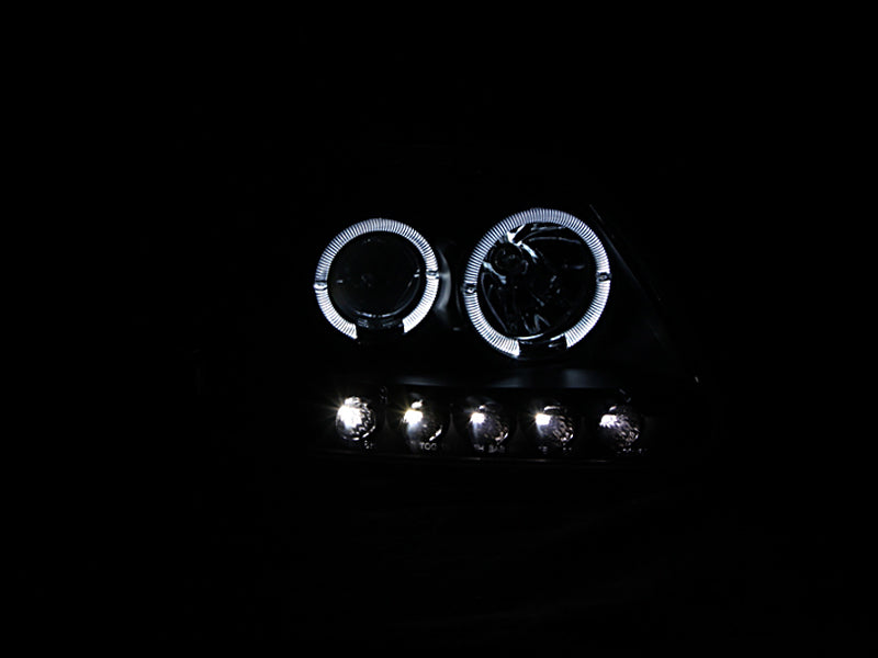 ANZO 1997.5-2003 Ford F-150 projector headlights with halo and LED lights in black housing, showcasing modern design and enhanced visibility.