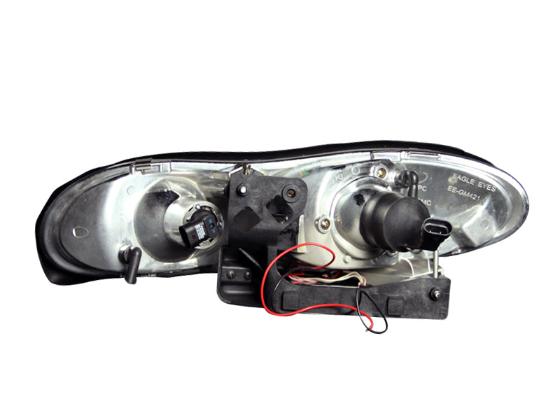 ANZO projector headlights with halo black design for 1998-2002 Chevrolet Camaro, featuring clear lens and black housing.