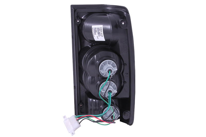 ANZO 1989-1995 Toyota Pickup taillights with chrome housing and clear lens, showcasing modern design and enhanced visibility.