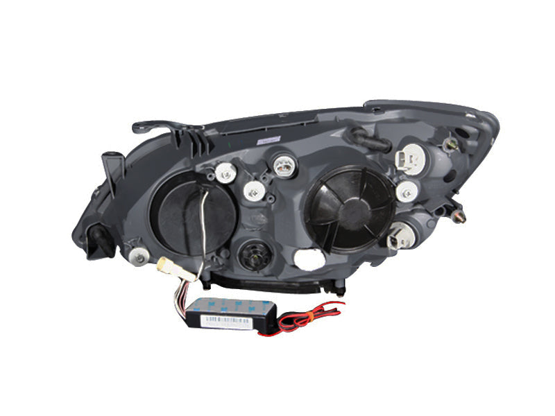ANZO projector headlights for 2001-2005 Lexus IS300 with halo lights and black housing, showcasing modern design and clear lens.