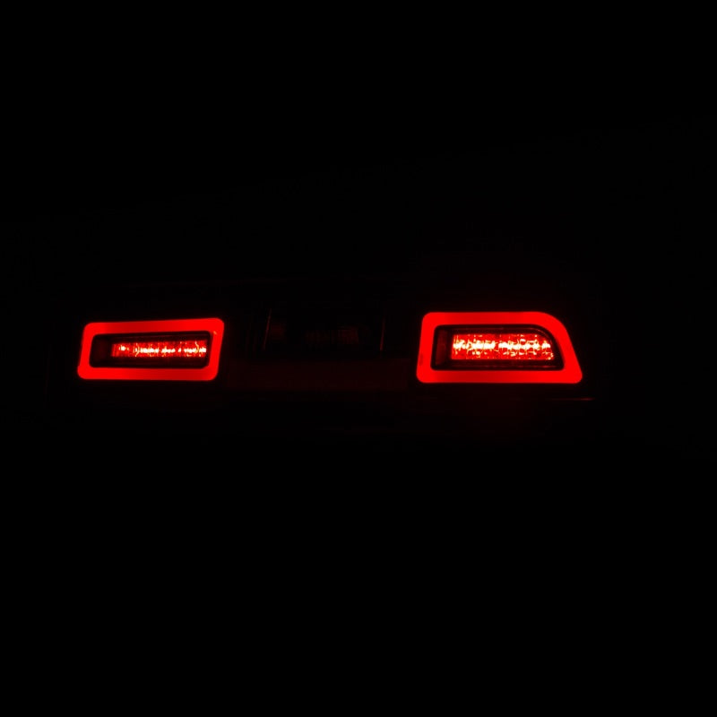 ANZO LED taillights in black for 2014-2015 Chevrolet Camaro, showcasing sleek design and bright LED illumination.