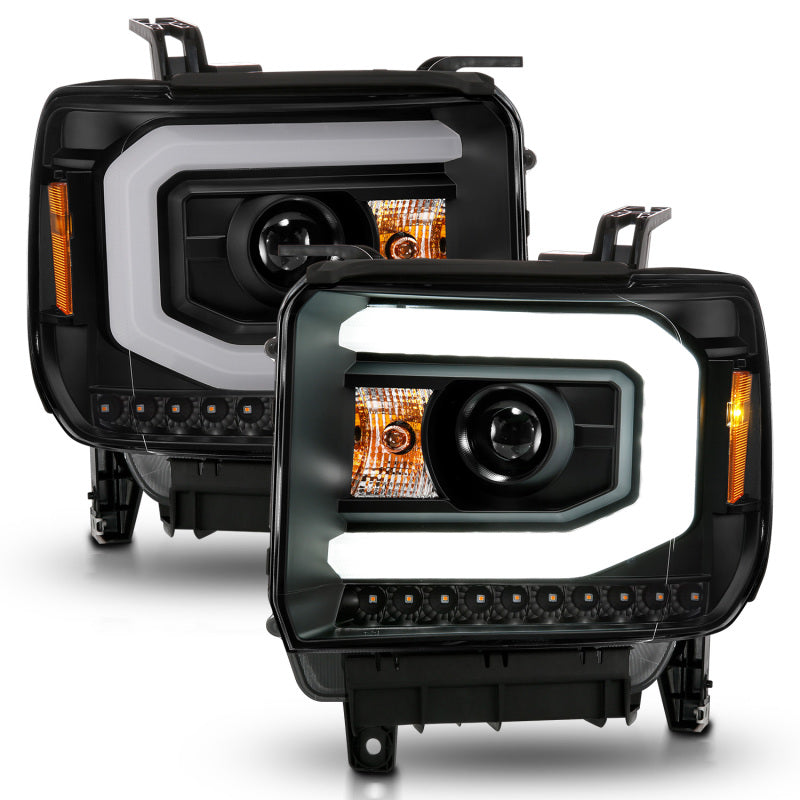 ANZO 2014-2015 GMC Sierra 1500 projector headlights with black housing and light bar, showcasing modern design and superior illumination.