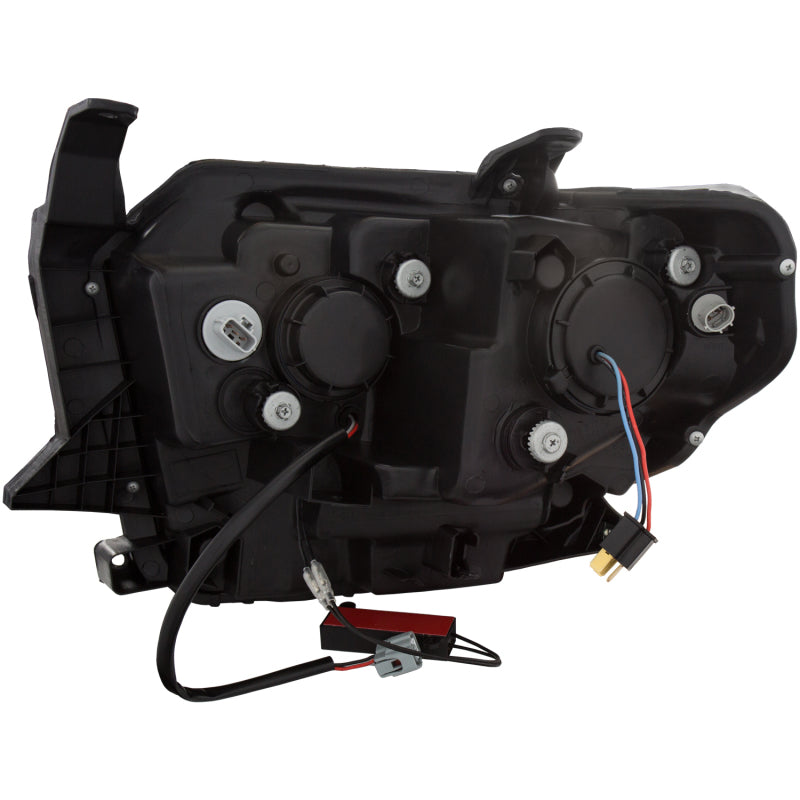 ANZO 2014-2015 Toyota Tundra projector headlights with U-Bar chrome design, showcasing clear lenses and chrome housing.