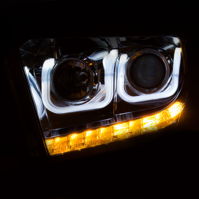 ANZO 2014-2015 Toyota Tundra projector headlights with U-Bar chrome design, showcasing clear lenses and chrome housing.