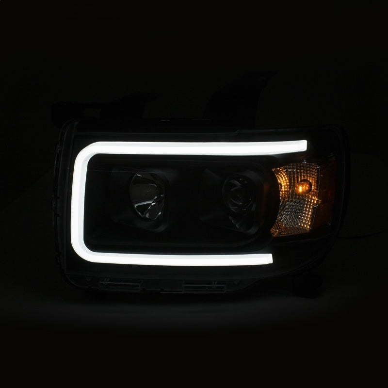 ANZO 2015+ GMC Canyon Projector Headlights with black housing and clear lens, showcasing a modern plank style design.